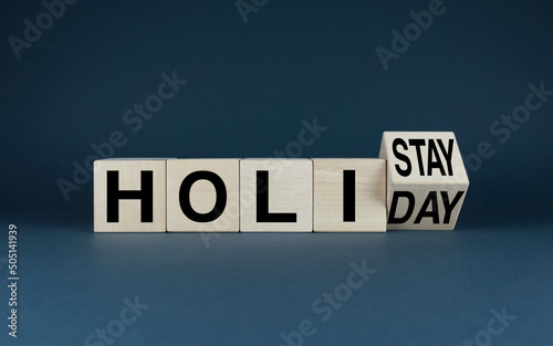 Cubes form words Holistay or Holiday