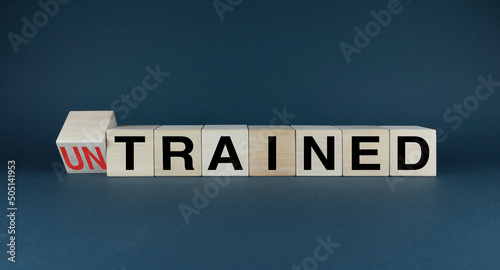 Untrained or Trained. Cubes form the choice words Untrained or Trained. photo
