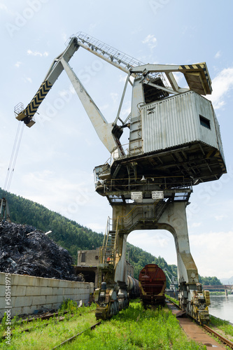 Large industrial crane and a heap of metal junk