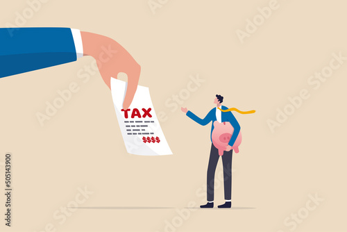 Tax burden or debt to pay for income tax, financial charge and duty to pay for government, accounting or bills, wealth management or savings, businessman holding saving piggybank looking at tax bills. photo