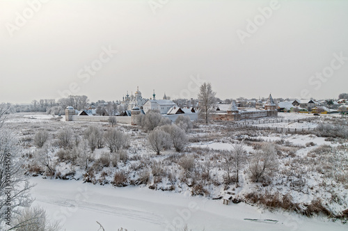 View of the Orthodox monastery from the high bank of the river. photo
