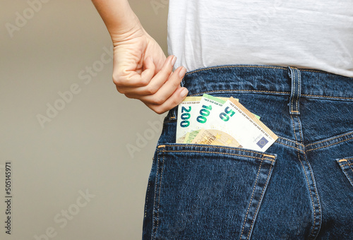 Two hundred euro paper banknotes in the back pocket of pants.