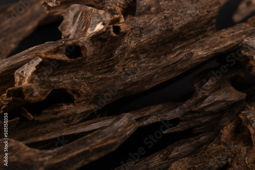 Fotografie, Obraz Close UpShot Of Sticks Of oudh On Black Background The Incense Chips Used By Bur