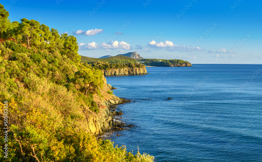 Beautiful panorama of summer seascape of Mediterranean sea. Green hills of Peloponnese peninsula, Greece, Europe.