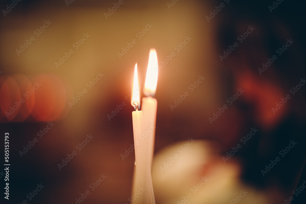 burning candle in the hands burning candle in the hands