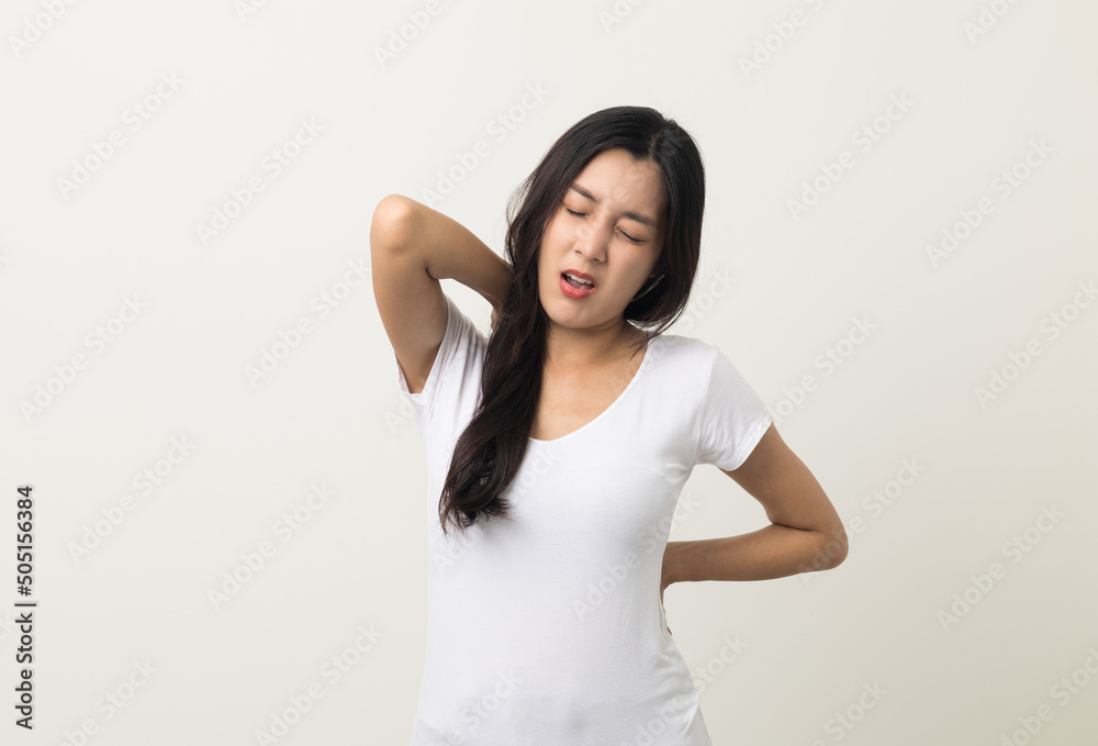 Asian woman has problem with structural posture She had neck and back pain. She massaged her neck and shoulders for relief. reduce muscle tension. Standing on isolated white background Asian woman has problem with structural posture She had neck and back pain. She massaged her neck and shoulders for relief. reduce muscle tension. Standing on isolated white background