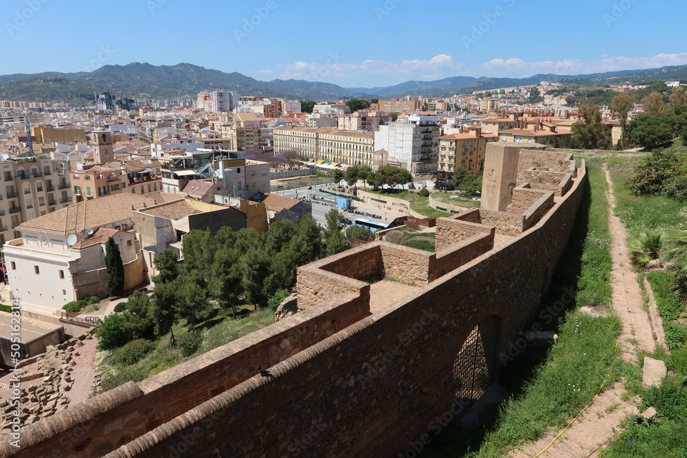 Malaga, Spain, May 8, 2022: Views of the city and walls of the Alcazaba of Malaga. Palatial fortification from the Islamic era built in the 11th century