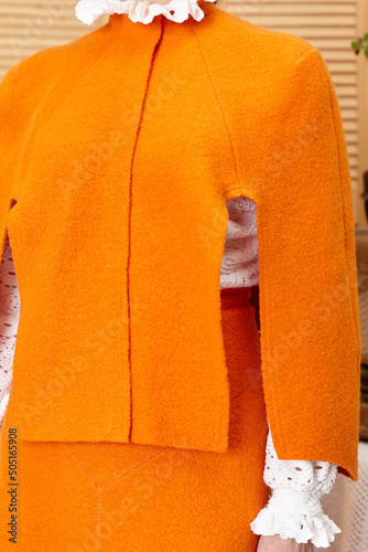  bright orange wool suit for women, front view