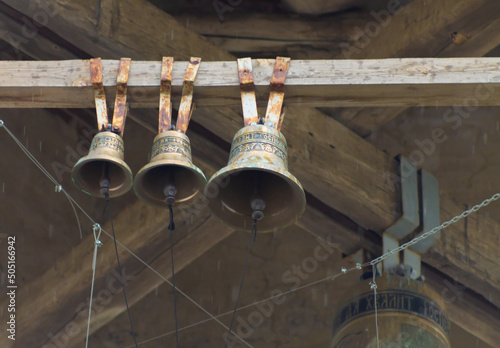 Russian church bells Church of the Icon of the Mother of God Lipetsk region Russia. Artistic photo. Added grain. photo