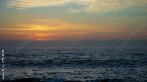 A early morning sunrise seen over the ocean on the south coast of South Africa