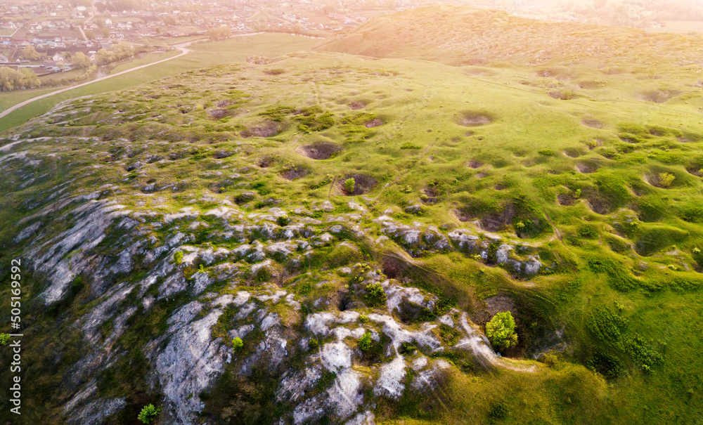 Aerial panoramic view of a scenic geological karst and limestone plateau with sinkholes and caves - obrazy, fototapety, plakaty 