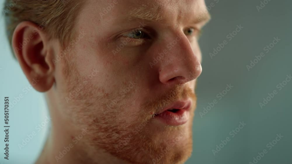 Focused man reading online blog closeup. Serious student learn interesting info