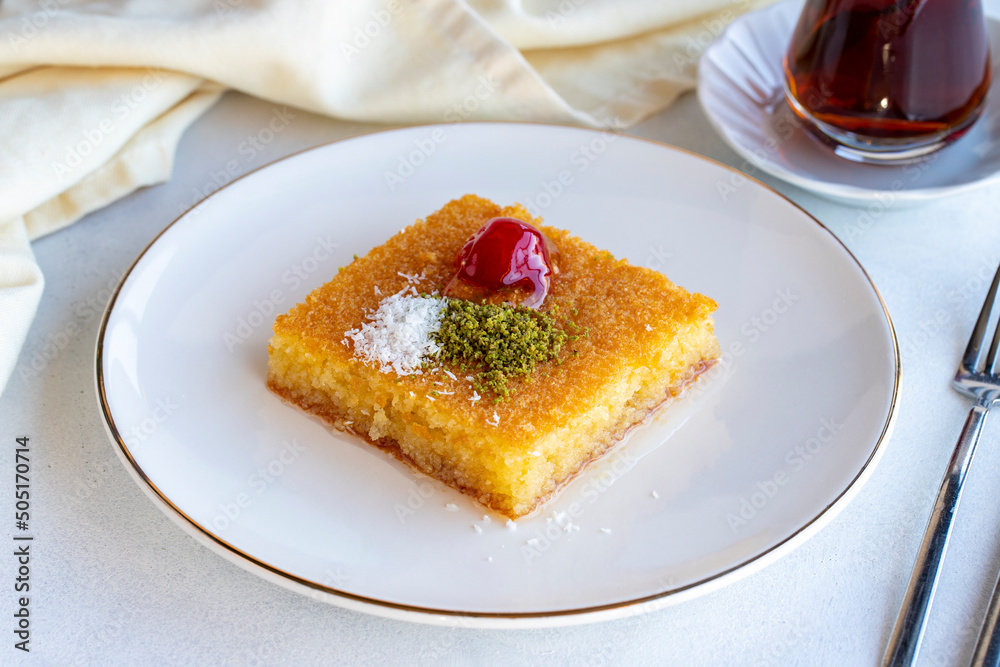 Kadayif dessert with pistachio on a white background. Traditional Turkish cuisine delicacies. close up Kadayif dessert with pistachio on a white background. Traditional Turkish cuisine delicacies. close up