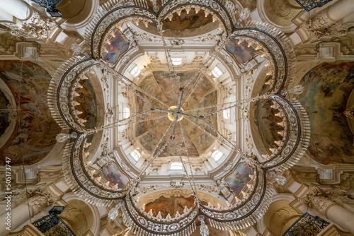 Church chandelier under main dome of Saint Nicholas church in Prague photo