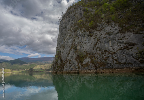 A series of cruises on the Drina River. Рeflections. A massive rock in the foreground.