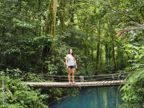 young woman hiking in rio celeste
