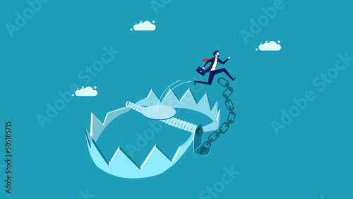 Avoid risks and problems. Businessman jumping out of a trap. business concept © Nastudio