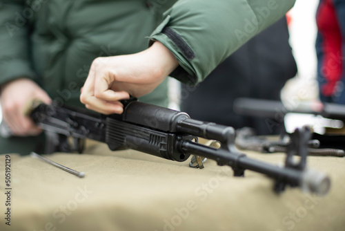 Assembly of Kalashnikov assault rifle. Details of military training in Russia. Firearms shooting lesson.