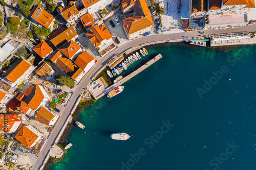 Aerial Panoramic view of the harbor and ships of the historic town of Perast in Kotor Bay in Montenegro