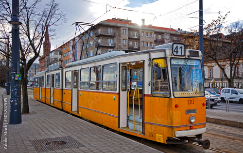 Orange tram on the street of Budapest, Hungary