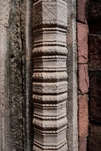The ancient stone pillar of a temple