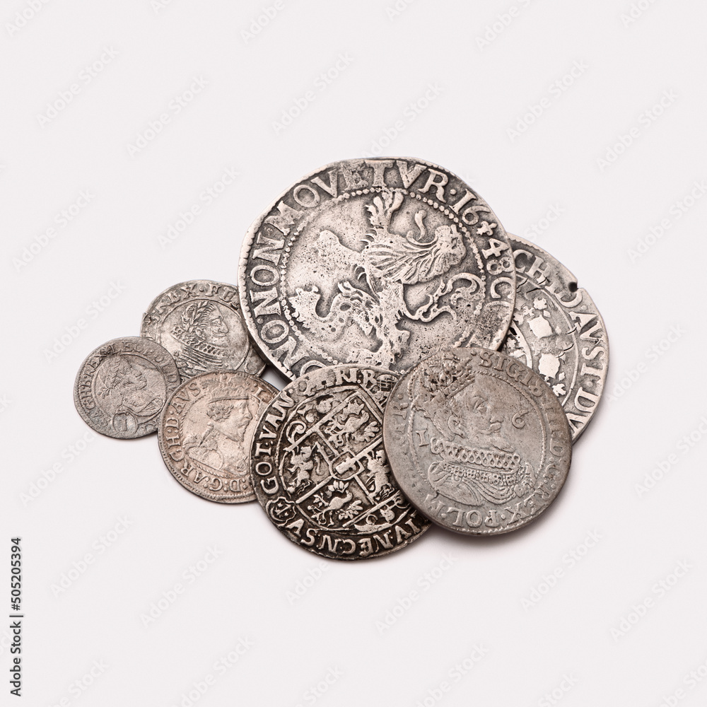 Old coins isolated on white background. Selective focus.