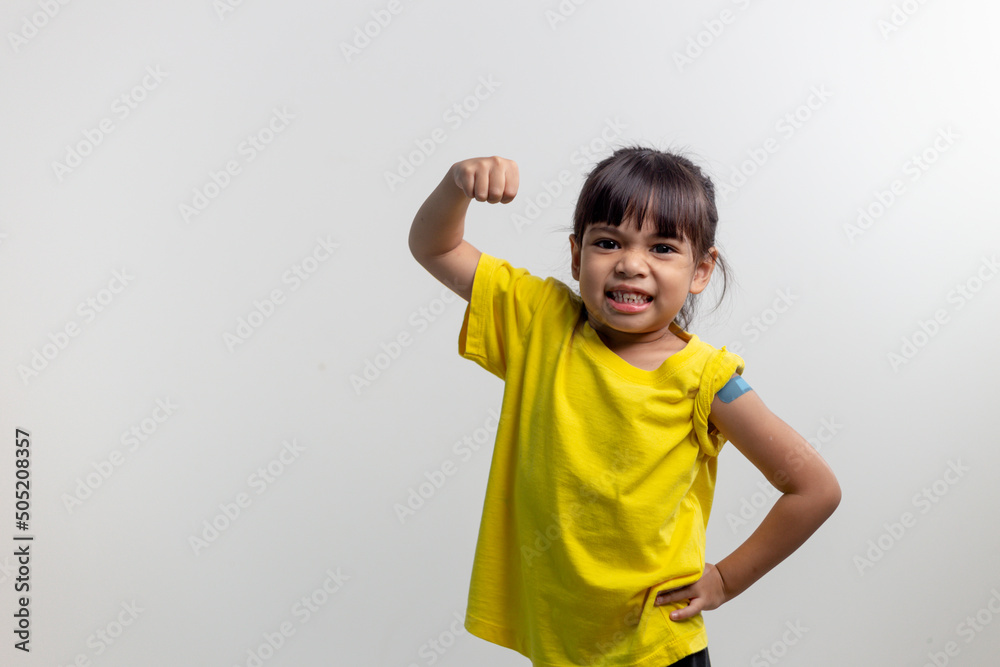 COVID 19 Vaccines for Kids concept. Studio a portrait of an adorable Asian girl after getting his first dose of vaccine. Immune, Safe, Available, Back to school. COVID 19 Vaccines for Kids concept. Studio a portrait of an adorable Asian girl after getting his first dose of vaccine. Immune, Safe, Available, Back to school.
