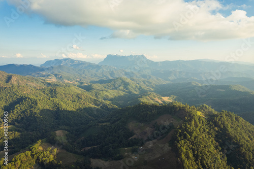 Scenery of Doi Luang Chiang Dao mountain peak with sunlight shining in tropical rainforest on countryside at national park