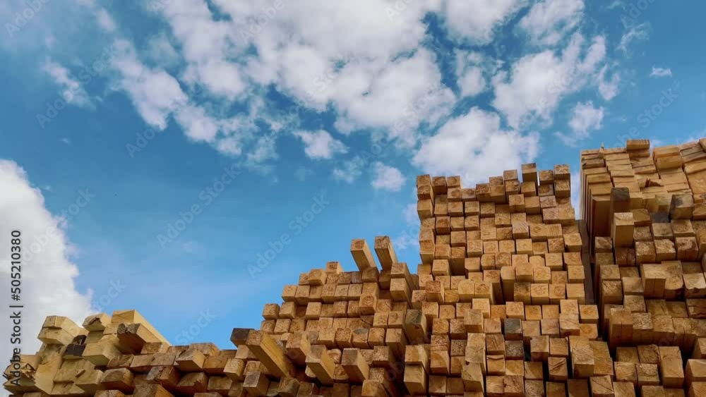 Wooden boards, lumber, industrial wood, timber. Pine wood timber stack of natural rough wooden boards on building site. Industrial timber building materials Wooden boards, lumber, industrial wood, timber. Pine wood timber stack of natural rough wooden boards on building site. Industrial timber building materials