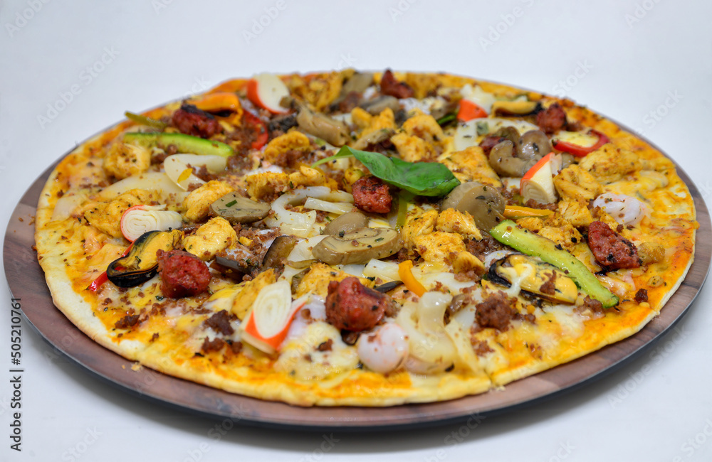 Chicken sausage and seafood pizza. isolated on a white background Chicken sausage and seafood pizza. isolated on a white background