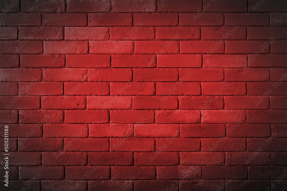 Fototapeta premium Ceglany mur pomalowany na czerwono.
