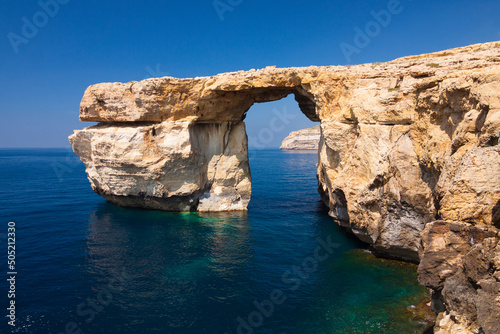 Malta - Gozo - Unique rock formation Azure window natural arch at the western coast of Dwejra bay photo