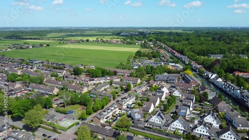 Vast idyllic Kortenhoef north Holland village aerial view towards rural countryside farmland photo