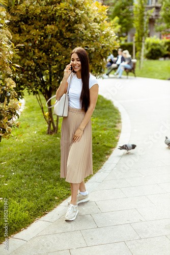 Young woman using a mobile ...