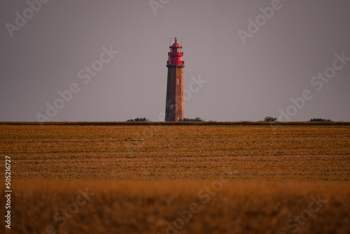 Fluegger lighthouse at sunset, Fehmarn Island in Germany photo