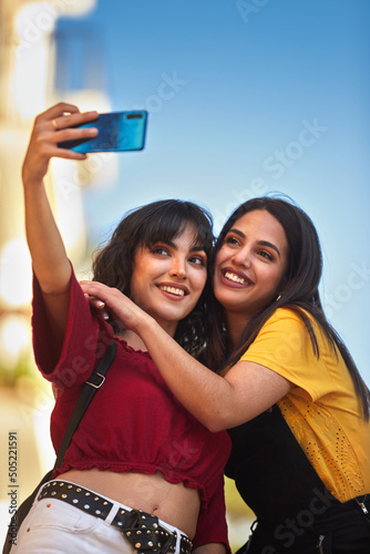 Two teenager girls taking a selfie.