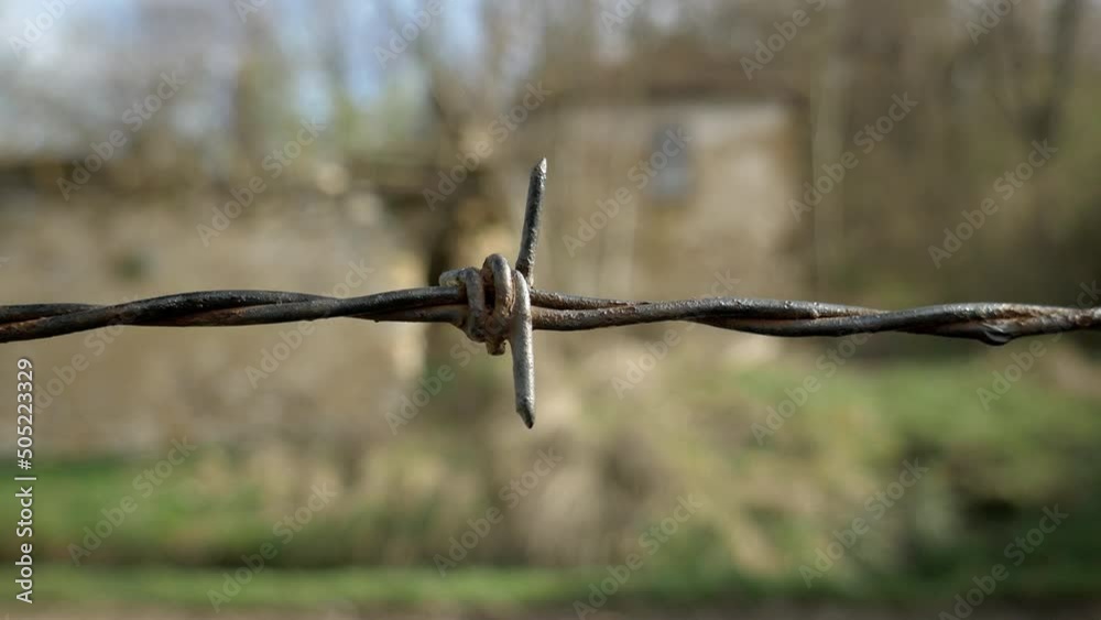 Old rusty barbed wire fence. Close up, handheld shot Old rusty barbed wire fence. Close up, handheld shot