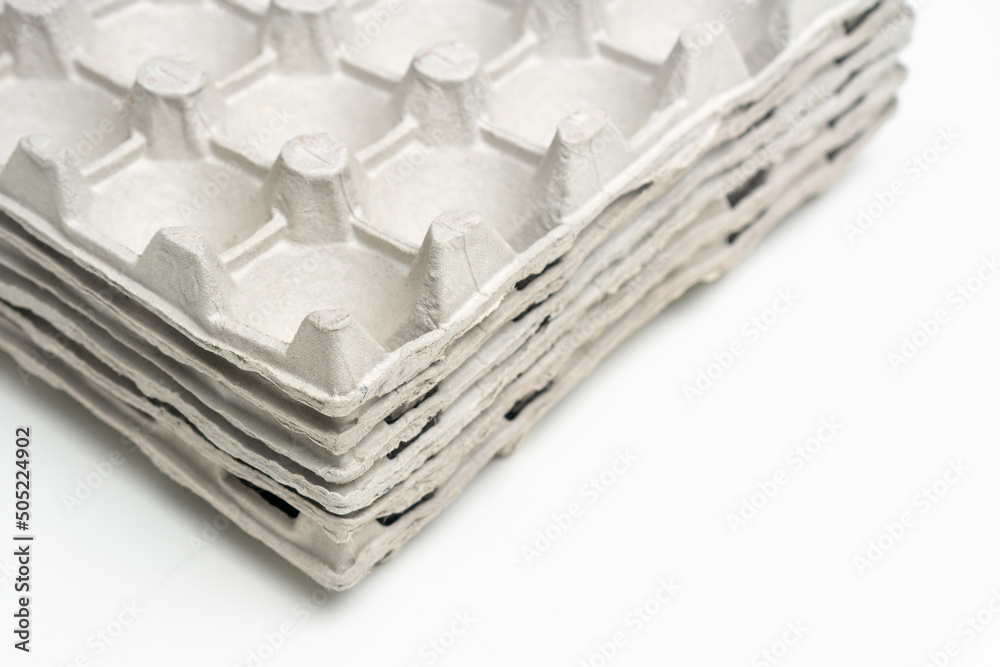 Stack of egg cartons stacked on top of each other