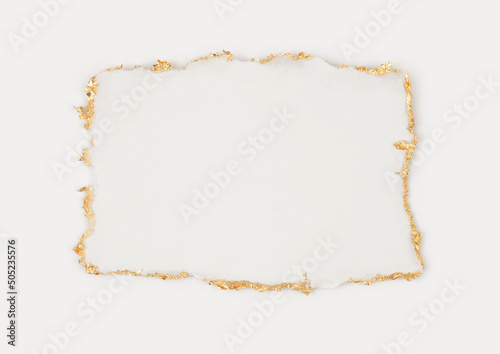 Gold (bronze) glitter empty frame on beige gray paper background. Abstract copy space texture. photo