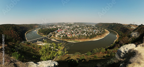 panoramic banner of Amazing view on the Dniester River Canyon. View to Zalishchyky town, Ternopil region, Ukraine. photo