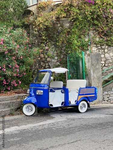 A small blue car in the streets of old Italian town © Karina