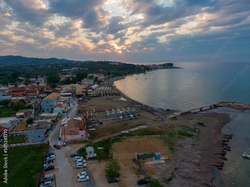 Beautiful aerial drone sunset with clouds over Roda beach in corfu island, Greece