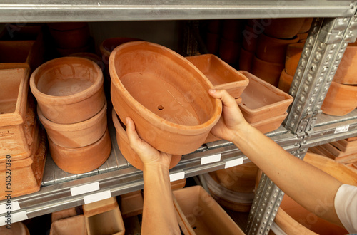 selecting of plant pots for flowers. Ceramic hand made pots