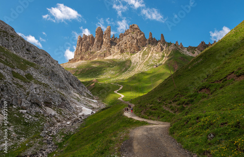 Hiking in the meadows of the Dolomites mountains
