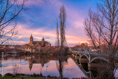 Salamanca Skyline view with Cathedral and Enrique Estevan Bridge on Tormes River, Spain photo