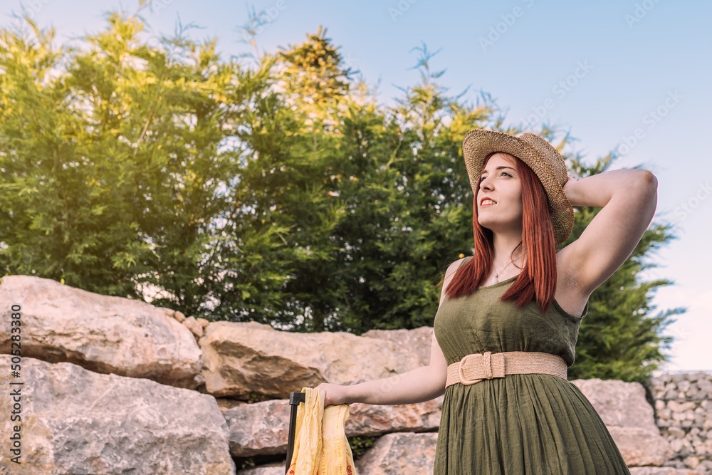 beautiful young girl travelling, enjoying the summer sun. concept of travel and leisure. tourist walking near the beach. beautiful young girl travelling, enjoying the summer sun. concept of travel and leisure. tourist walking near the beach.