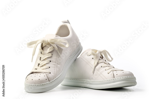 Pair of Stylis New White Sneakers Over White Background. Isolated with Clipping Path