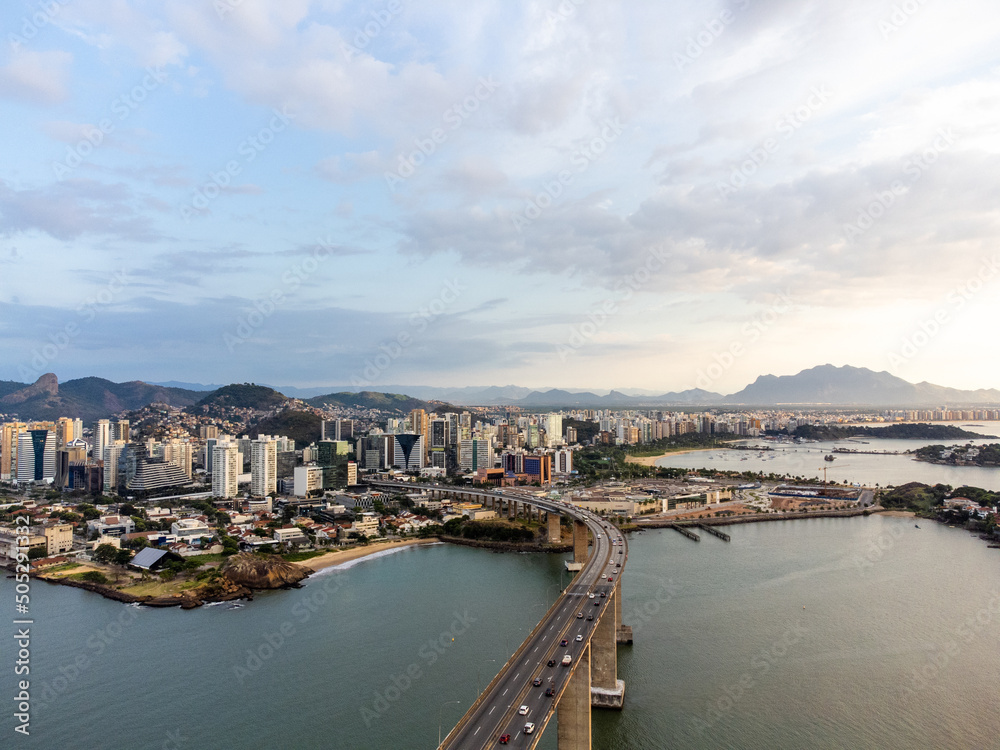 Amazing coastal city one of the capitals of Brazil Vitoria with long bridge over the canal - aerial drone view