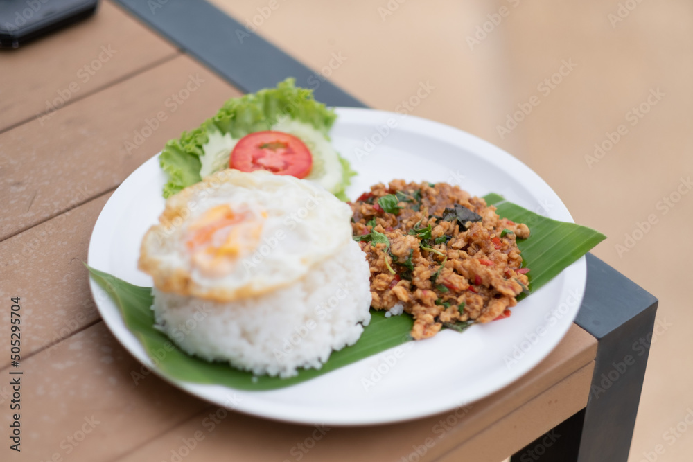  basil pork rice with fried egg . thai food