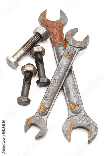 Old rusty wrench, isolated on white background